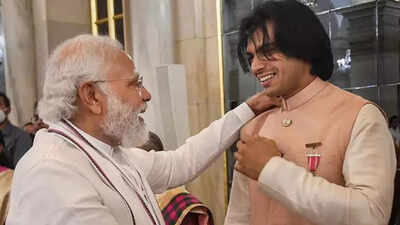 Pm modi and neeraj chopra pti photo.jpg