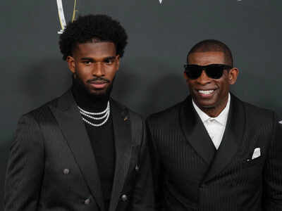 Coach prime and his son shedeur.jpg