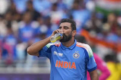 Dubai india39s bowler mohammed shami after suffering an injury on his hand durin.jpg