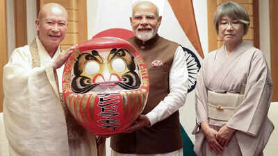 Pm modi is presented with a daruma doll in japan.jpg