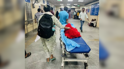 A couple take their 12 year old son from emergency ward to child emergency ward at lnjp on a stretch.png
