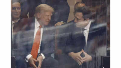 Elon musks pyramid hand symbol at charlie kirks memorial.jpg