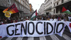 People hold a banner reading quotgenocidequot as they participate at a demonstration part of a natio.jpeg
