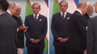 Pm modi putin walk past pakistan pm at sco summit shehbaz sharif left looking on.jpg