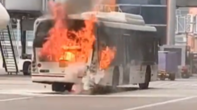 A bus operated by ai sats caught fire near an aircraft at delhi airport39s terminal 3.jpg