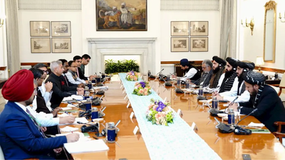 External affairs minister s jaishankar with his afghani counterpart amir khan muttaqi during a meeti.png