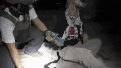 Israeli officer with greta at one of the vessels of the hamas sumud flotilla.jpg