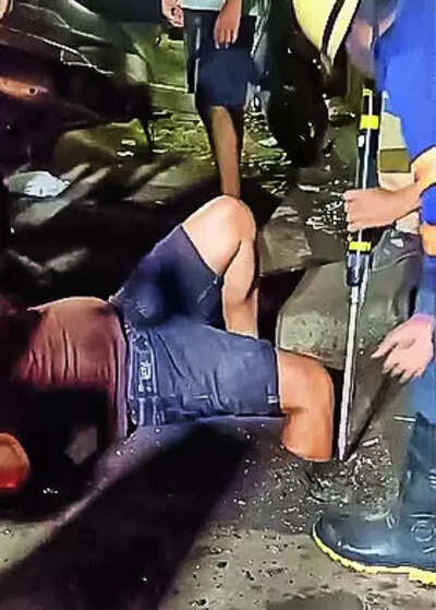 Mans leg stuck in mum drain hole freed after 4 hrs.jpg