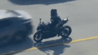 Motorcyclist crashes into car.jpg