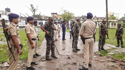 Security personnel keep vigil outside a hospital where the post mortem of jan suraaj leader late dul.png