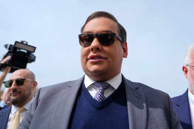 Who is george santos ex gop rep who lied about his education and now has his prison sentence commute.jpeg