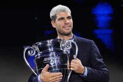 Carlos alcaraz beams with pride as he lifts trophy for year end no 1 player.jpg
