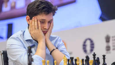 Gm andrey esipenko in deep thoughts during his match against nodirbek yakubboev for the third candid.jpeg