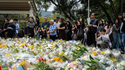 People gather to offer prayers to victims ap.jpg