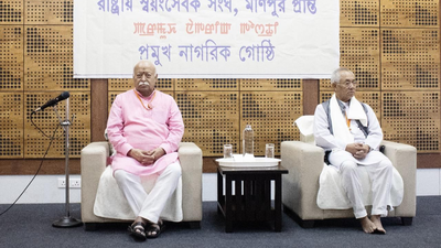 Rss chief mohan bhagwat left.jpg