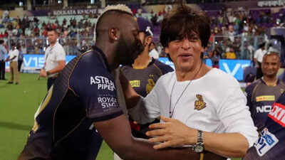 Shah rukh khan with andre russell.jpg