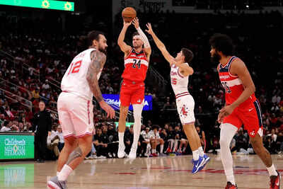 Washington wizards forward corey kispert 24 shoots outside against houston rockets guard reed sheppa.jpeg