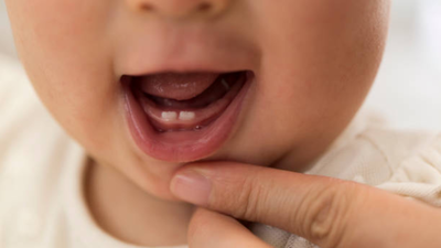 What makes baby teeth come in early or late study points to moms hormones.jpg