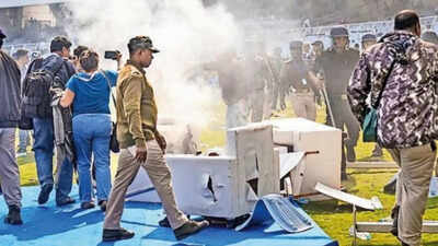 At around 1210 pm barely 18 minutes after the star had exited fans started crossing the barriers and.jpeg