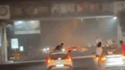 Men in high speed cars perform deadly stunts.jpg