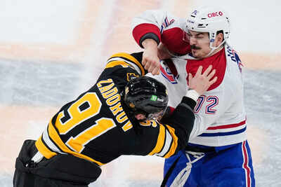 Old rivals bruins canadiens drop gloves at opening faceoff in matchup of east conference foes.jpg