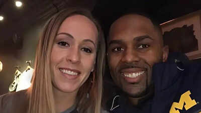 Sherrone moore and his wifekelli.jpg