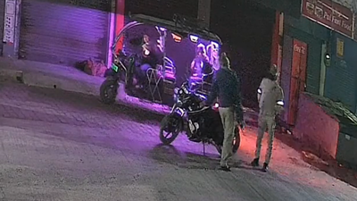 Shocking cctv footage revealed police officers dumping an unidentified body outside a shop in meerut.png