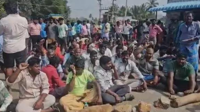 Villagers staging a sit in protest at r k pet state highway.jpg