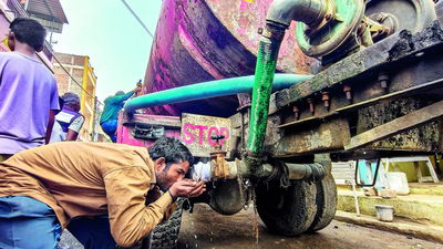 A man drinks water from a tanker in bhagirathpura indore saturday.jpg