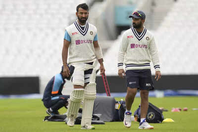 London india39s cheteshwar pujara left and india39s ajinkya rahane right duri.jpg