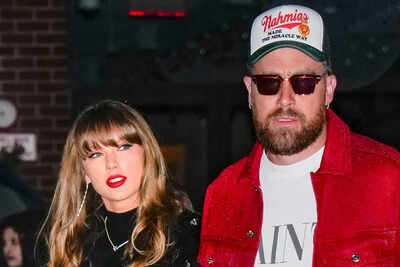 Taylor swift left and travis kelce right.jpg