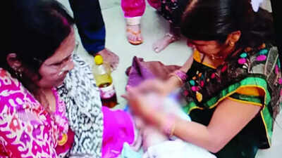 The baby being given heat therapy after she was pulled out from the well.jpg