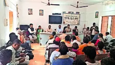 Villagers attend a peace committee meeting in the presence of police and administrative officers.jpg