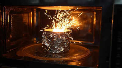 Why does aluminium foil spark in a microwave but not in an oven.jpg
