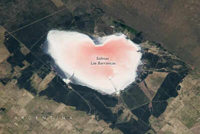 Nasa captures heart shaped lake glowing pink in argentina image source nasa.jpg