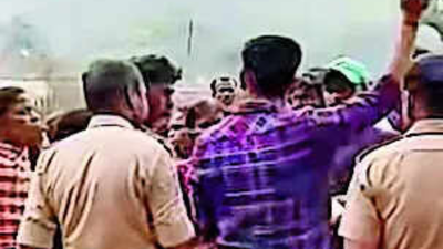 A mob of villagers assaults the headmaster on saturday.jpg