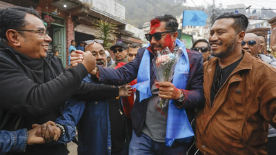 Biraj bhakta shrestha second right arrives at the election commission after victory pti.jpg