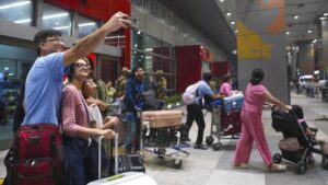 Indians returning from abu dhabi at the igi airport in new delhi monday.jpg
