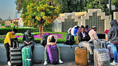Passengers await for assistance at dubai airport parking lot on sunday.jpg