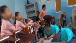 Up headmistress gets foot massage from class 5 students during school hours.jpg
